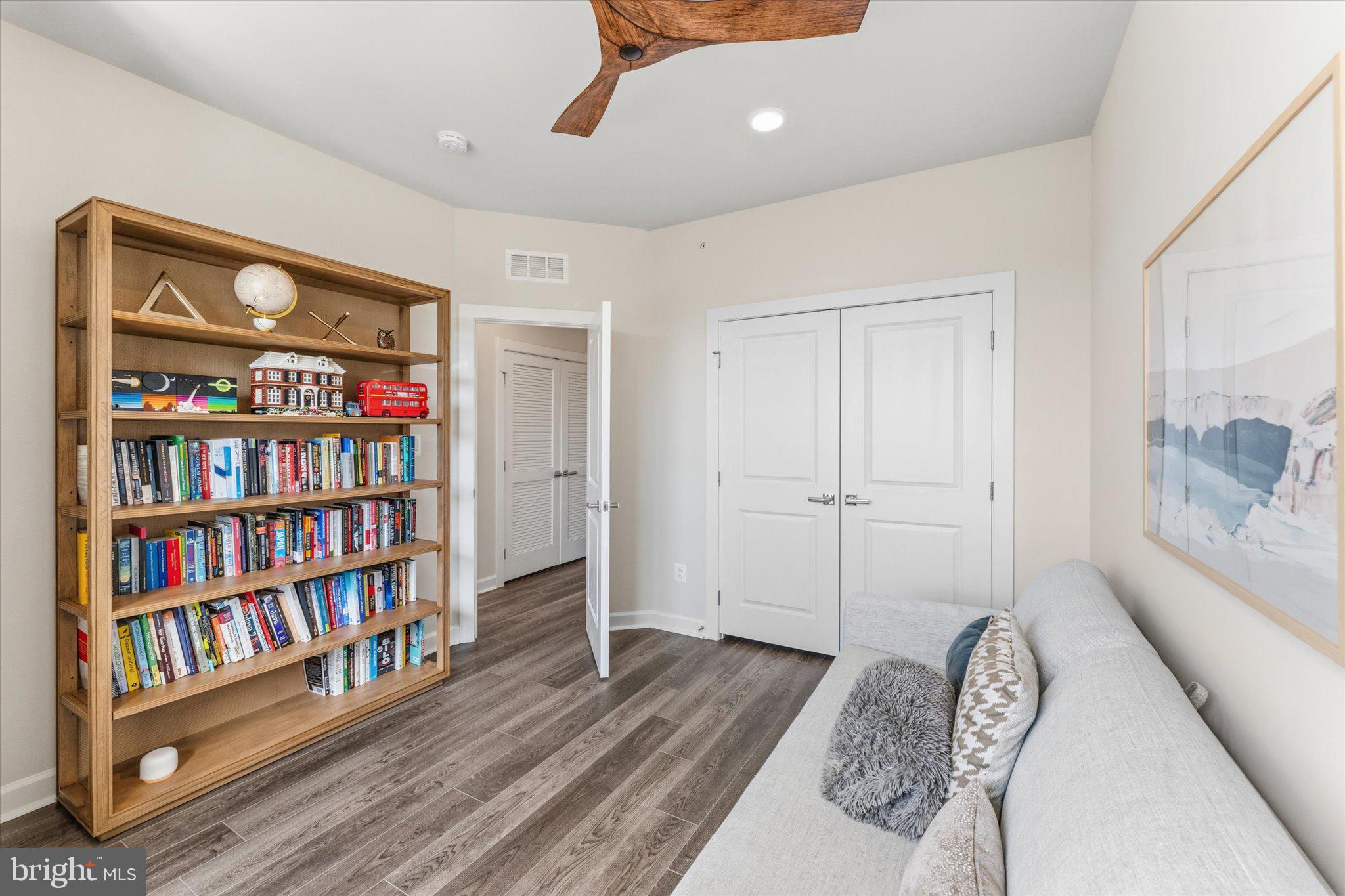 12915 Sunrise Ridge Alley, Unit 74 Herndon, VA 20171 - Photo 30 of 48 a view of room with furniture and book shelf
