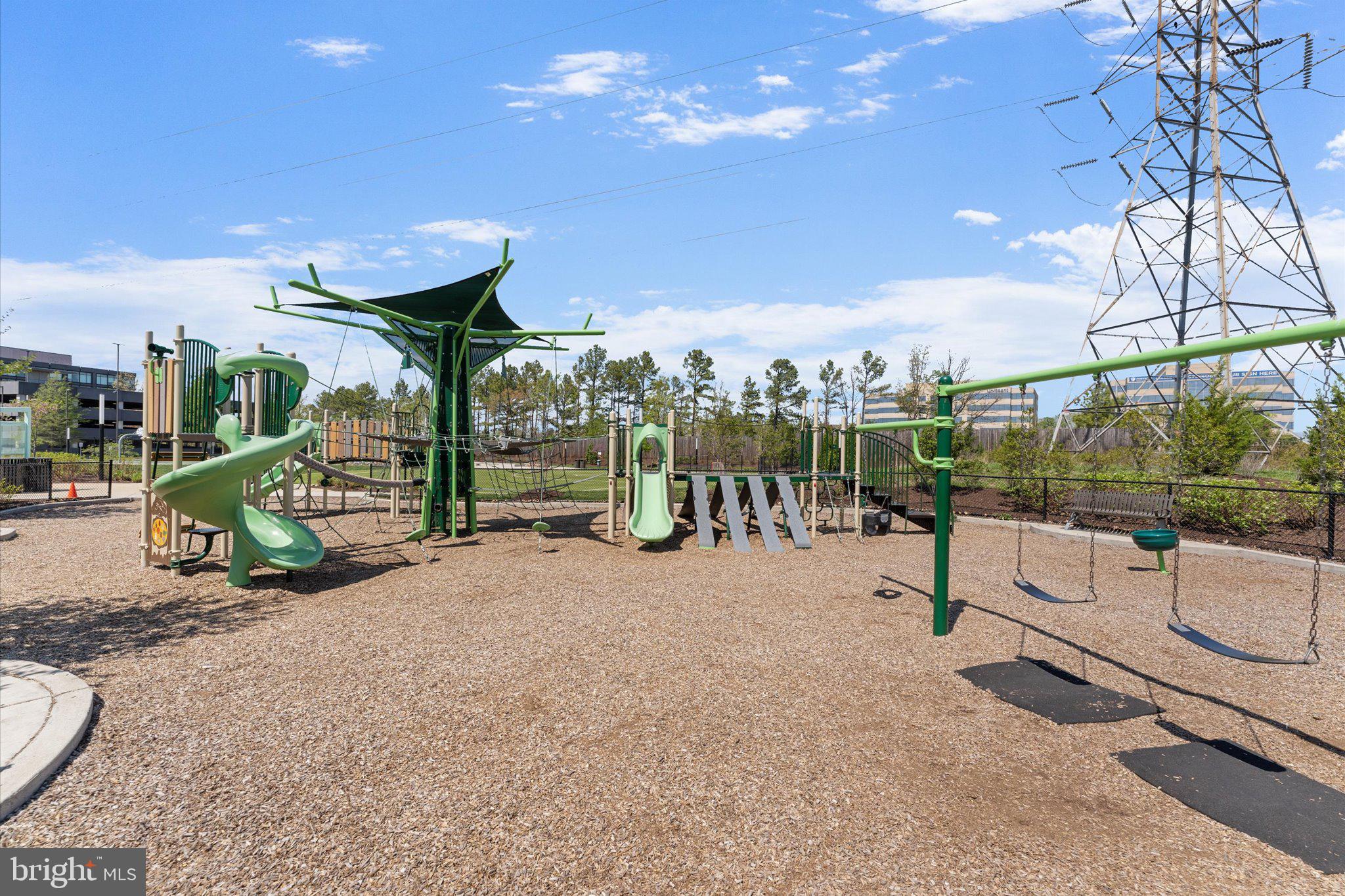12915 Sunrise Ridge Alley, Unit 74 Herndon, VA 20171 - Photo 35 of 48 a view of a park with slide