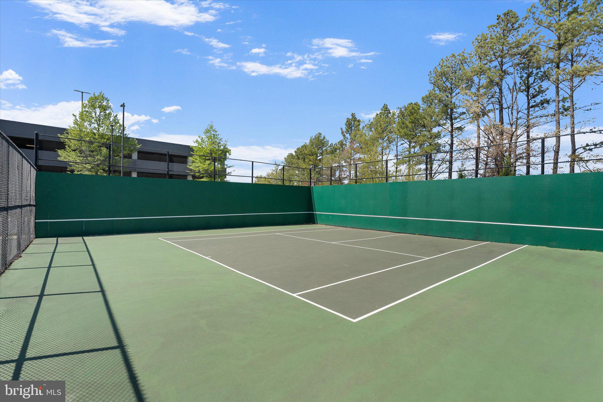 12915 Sunrise Ridge Alley, Unit 74 Herndon, VA 20171 - Photo 38 of 48 a view of an outdoor space and tennis court