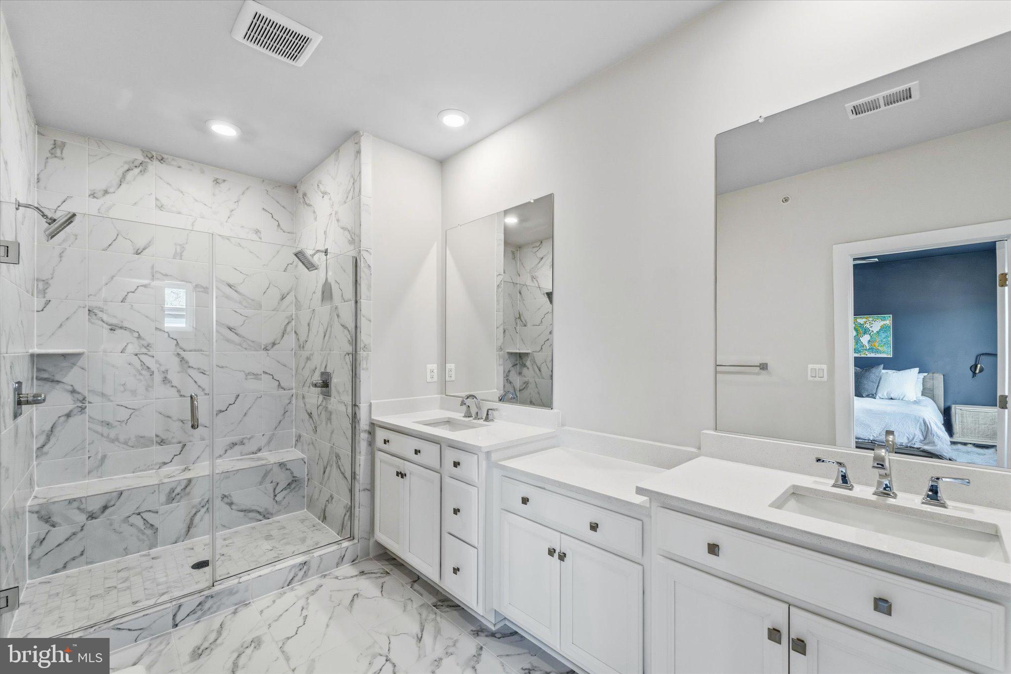 12915 Sunrise Ridge Alley, Unit 74 Herndon, VA 20171 - Photo 4 of 48 a spacious bathroom with double sink and a mirror