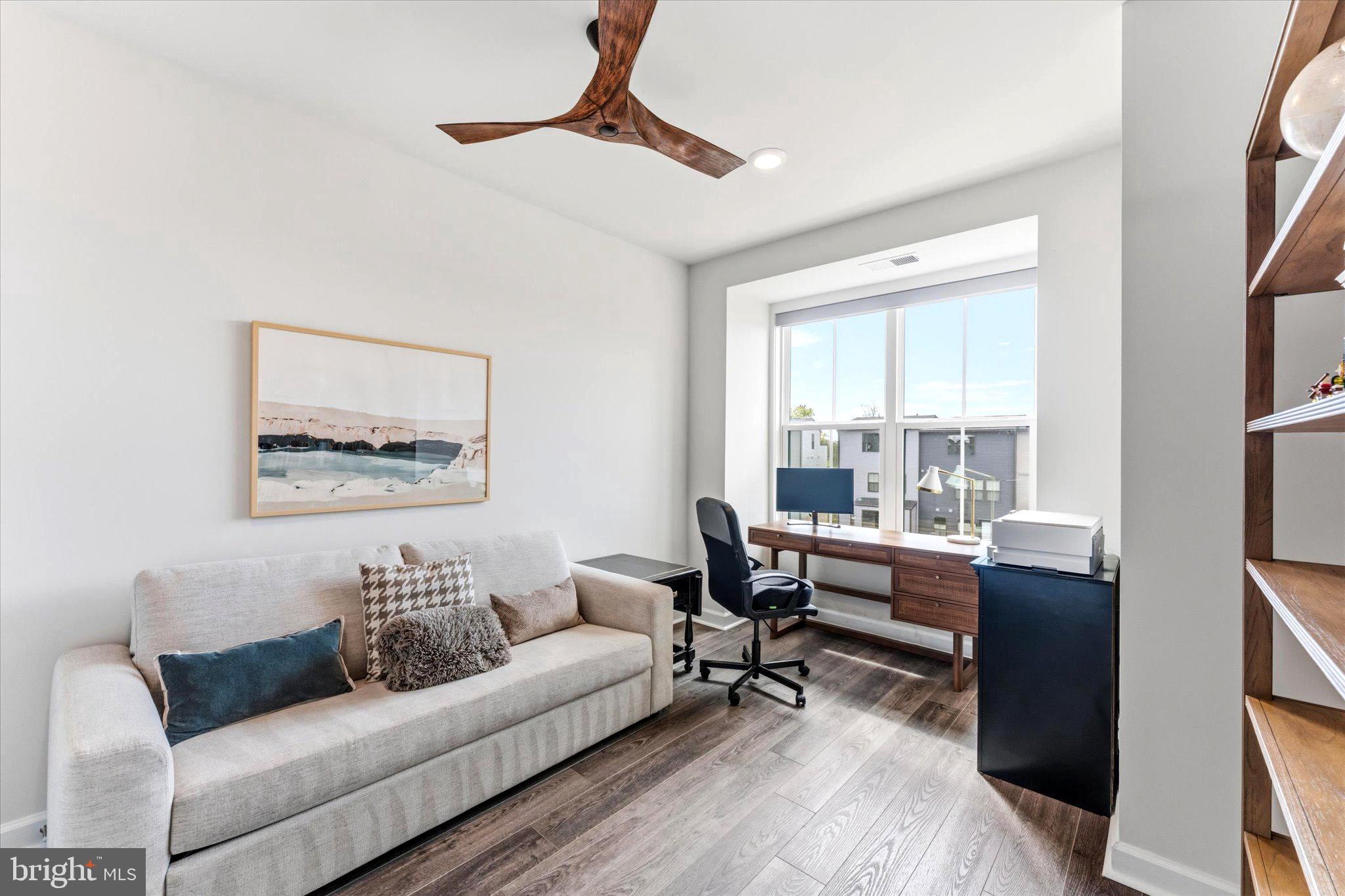 12915 Sunrise Ridge Alley, Unit 74 Herndon, VA 20171 - Photo 6 of 48 a living room with furniture and a large window