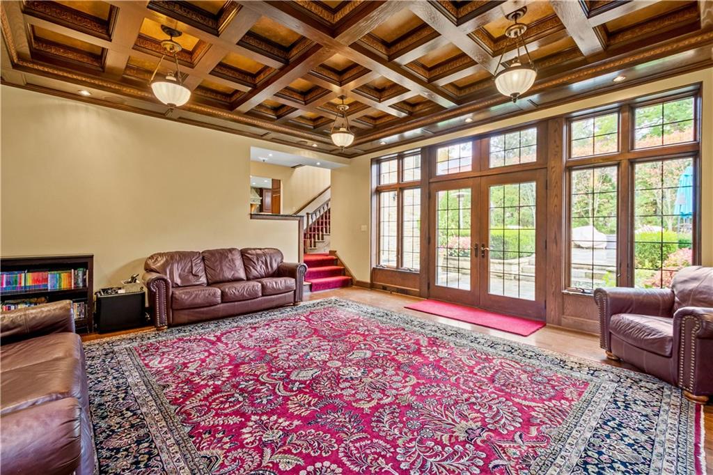 776 Valleyview Road Pittsburgh, PA 15243 - Photo 12 of 25 a living room with furniture and a rug