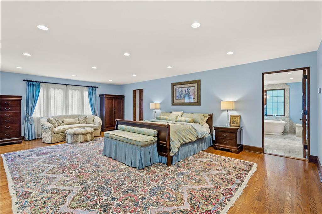 776 Valleyview Road Pittsburgh, PA 15243 - Photo 13 of 25 a spacious bedroom with a bed and a couch