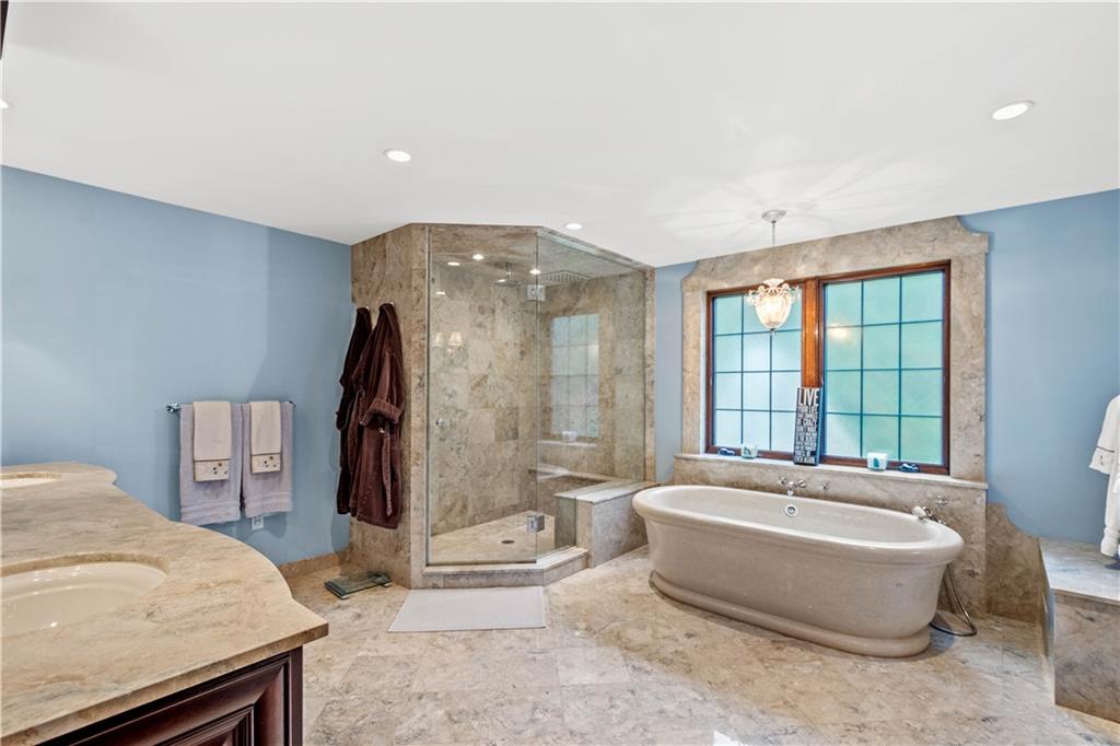 776 Valleyview Road Pittsburgh, PA 15243 - Photo 14 of 25 a spacious bathroom with a tub and shower