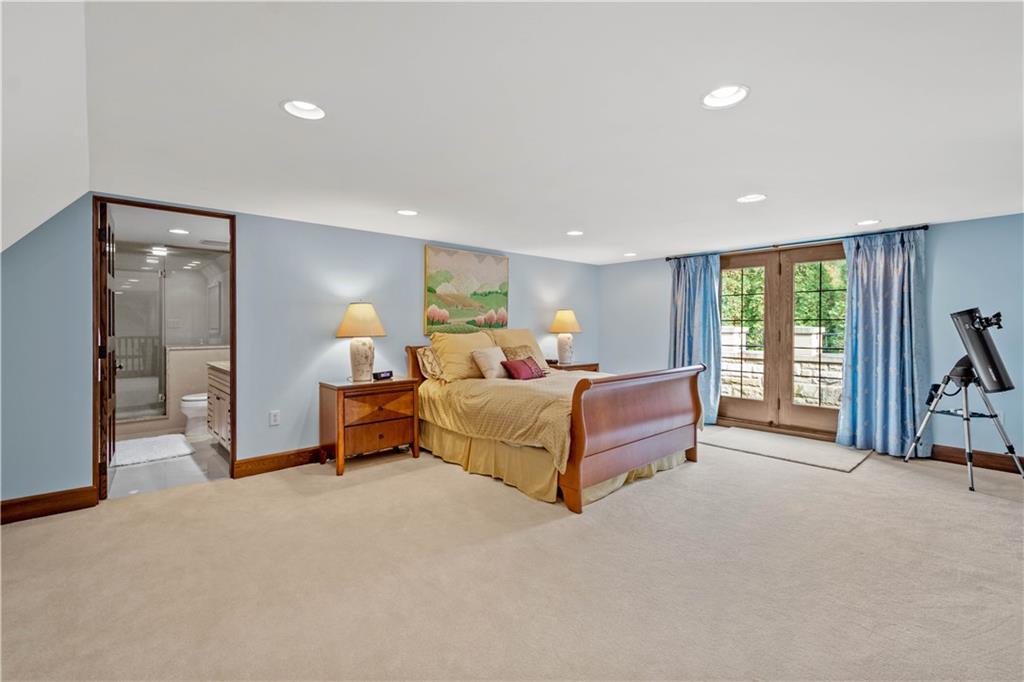 776 Valleyview Road Pittsburgh, PA 15243 - Photo 20 of 25 a spacious bedroom with a bed and large windows