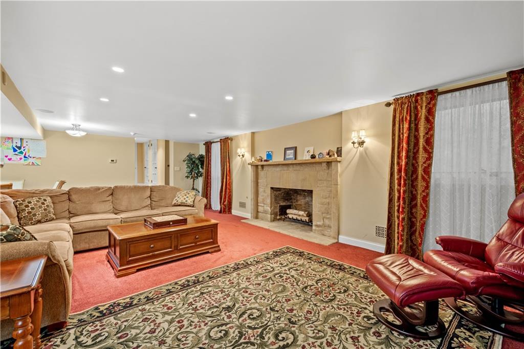 776 Valleyview Road Pittsburgh, PA 15243 - Photo 21 of 25 a living room with furniture and a fireplace