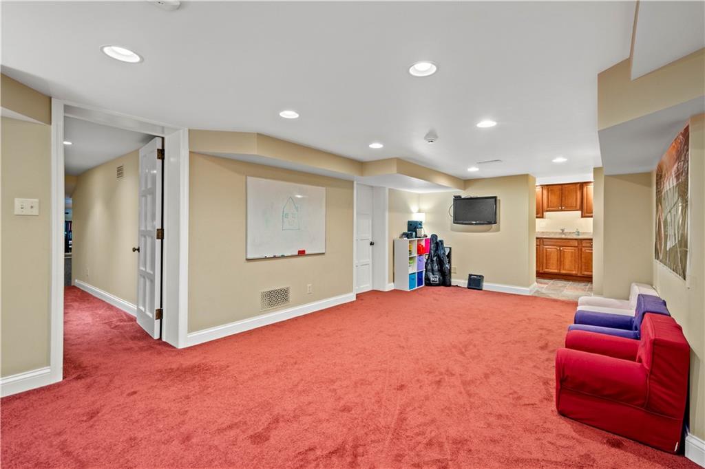 776 Valleyview Road Pittsburgh, PA 15243 - Photo 22 of 25 a living room with furniture and a flat screen tv