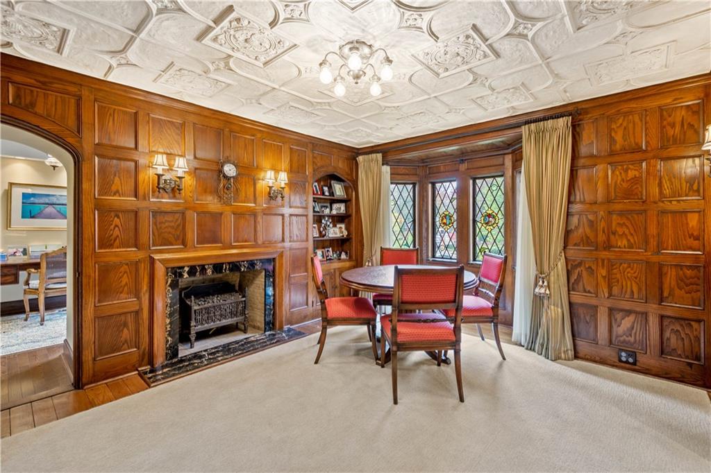 776 Valleyview Road Pittsburgh, PA 15243 - Photo 10 of 25 a living room with furniture a fireplace and a table