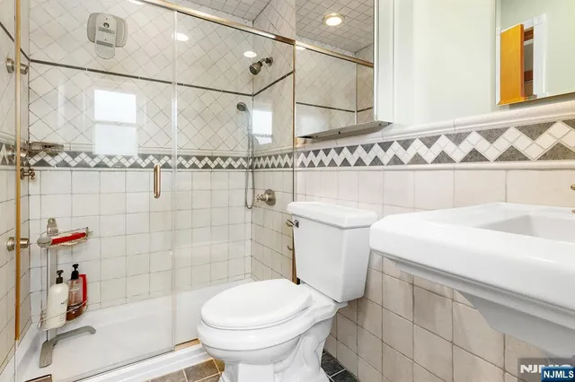a bathroom with a sink and a shower curtain