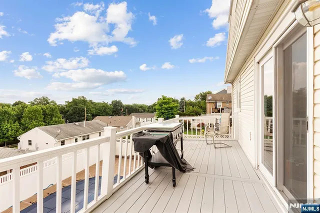 a view of balcony with furniture