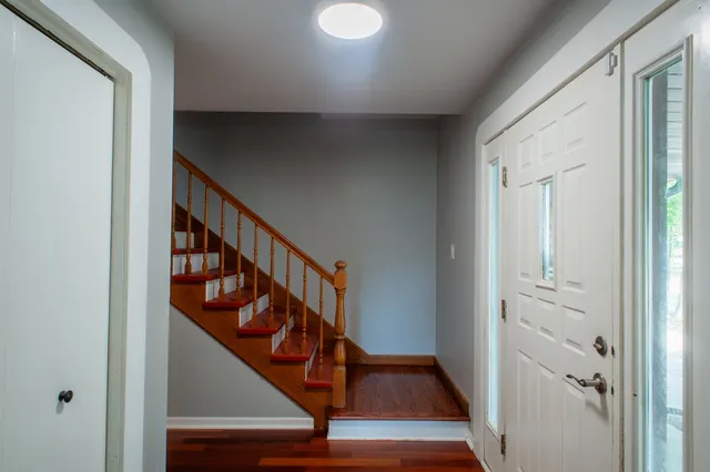 a view of entryway with wooden floor