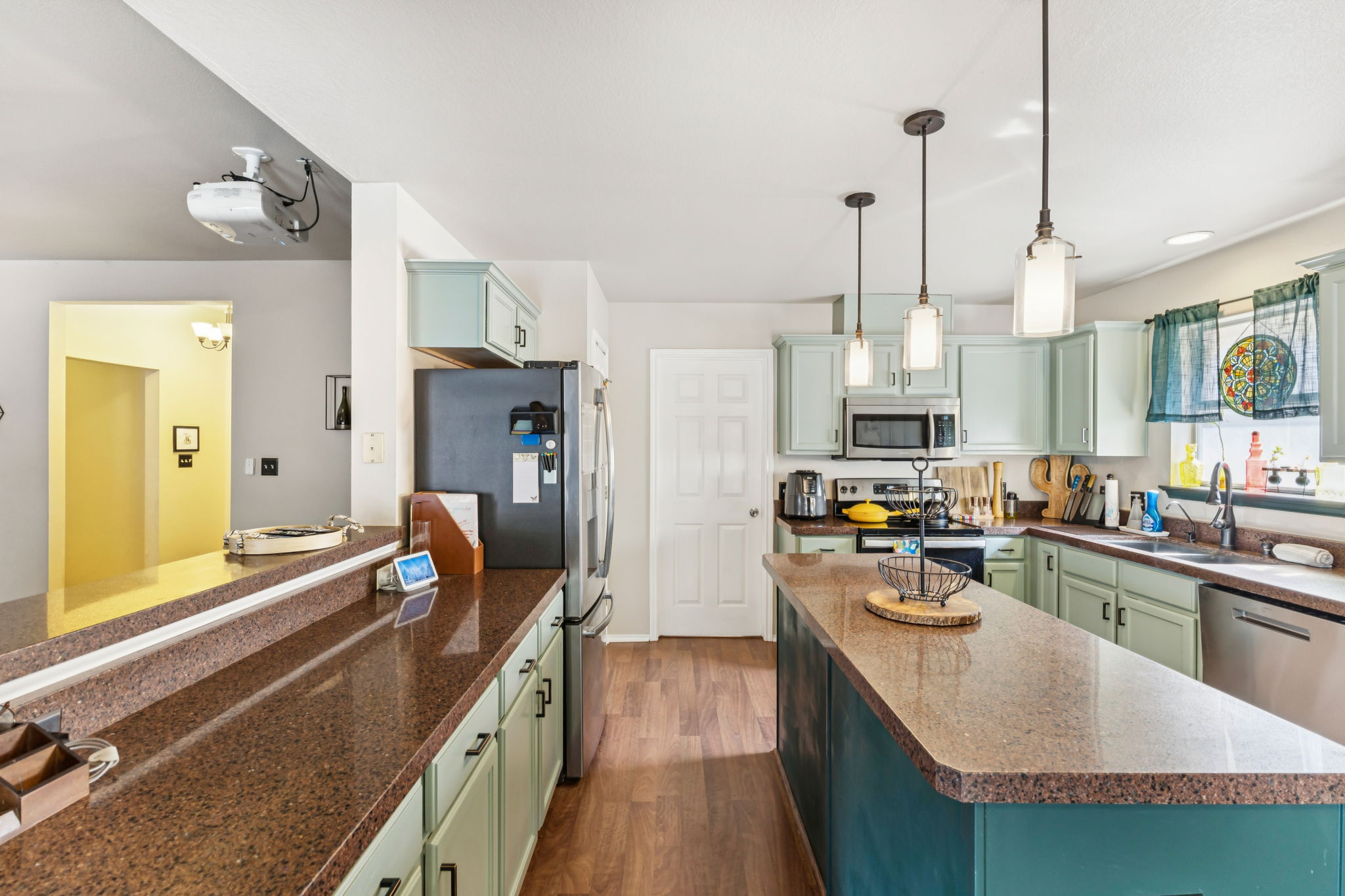 2412 Chestnut Path Round Rock, TX 78664 - Photo 7 of 26 An inviting kitchen features a central island, ample counter space, and modern appliances.