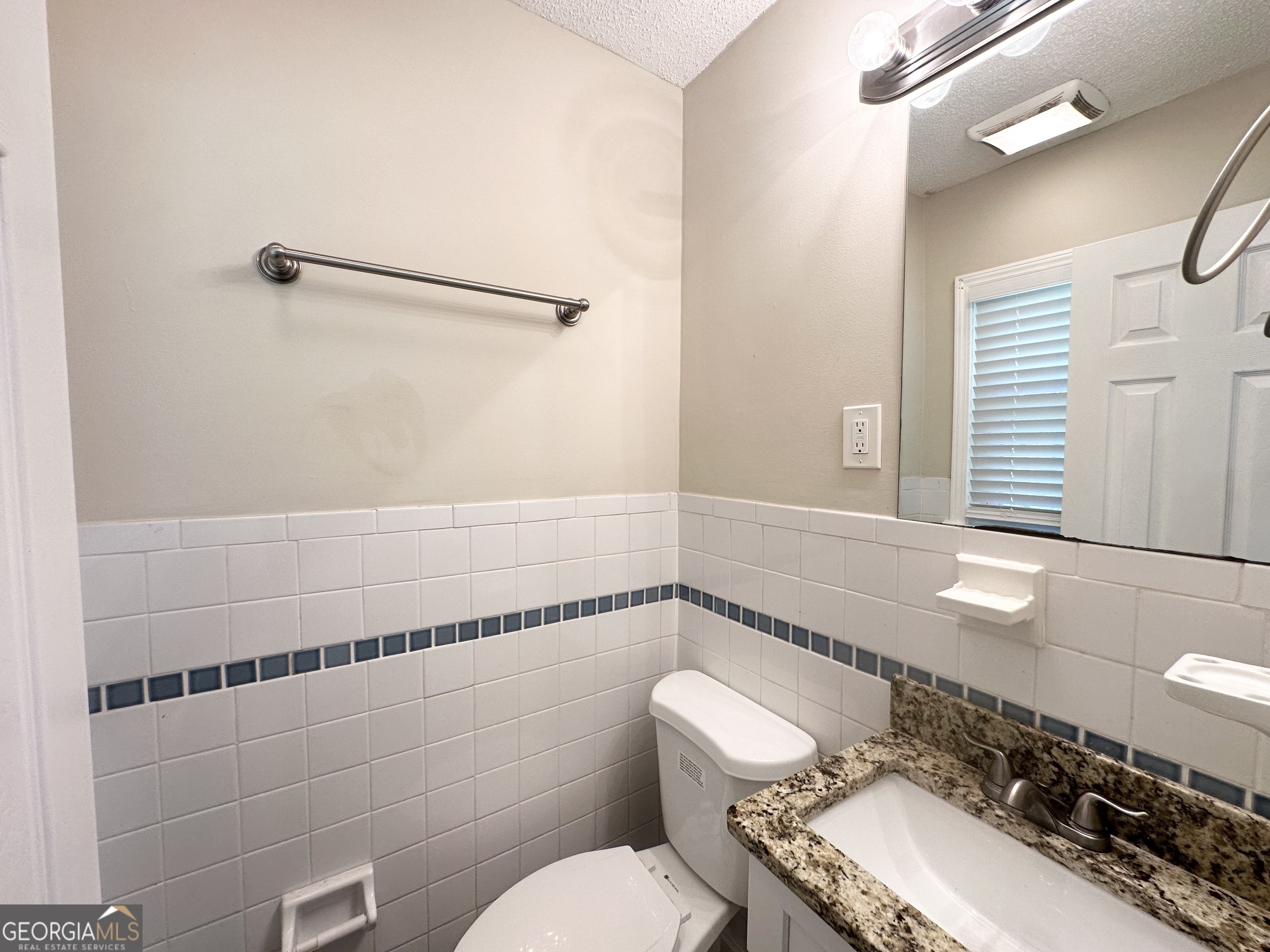 1089 Canal Street Decatur, GA 30032 - Photo 11 of 18 a bathroom with a sink mirror vanity and toilet