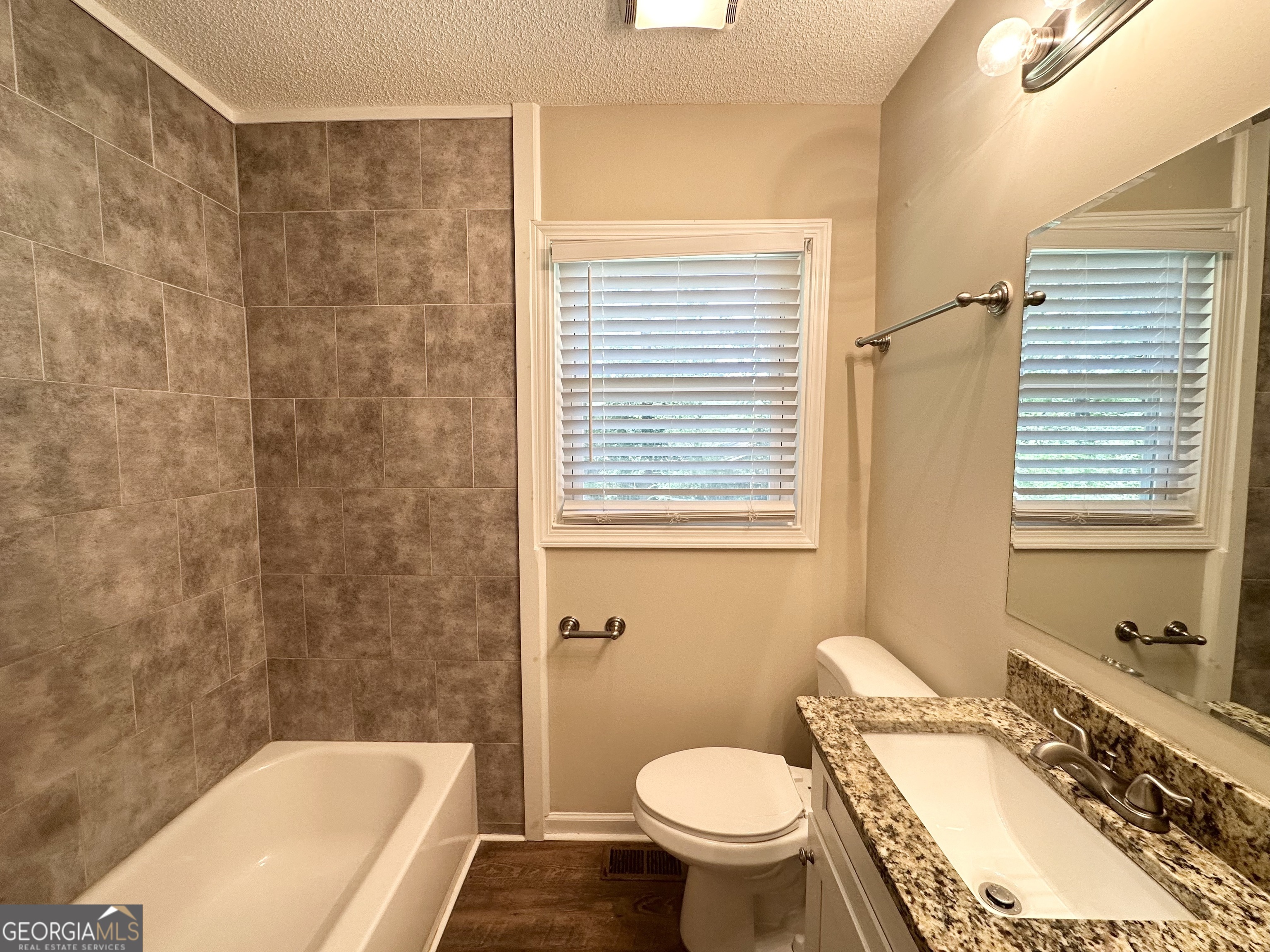 1089 Canal Street Decatur, GA 30032 - Photo 12 of 18 a bathroom with a sink and a mirror