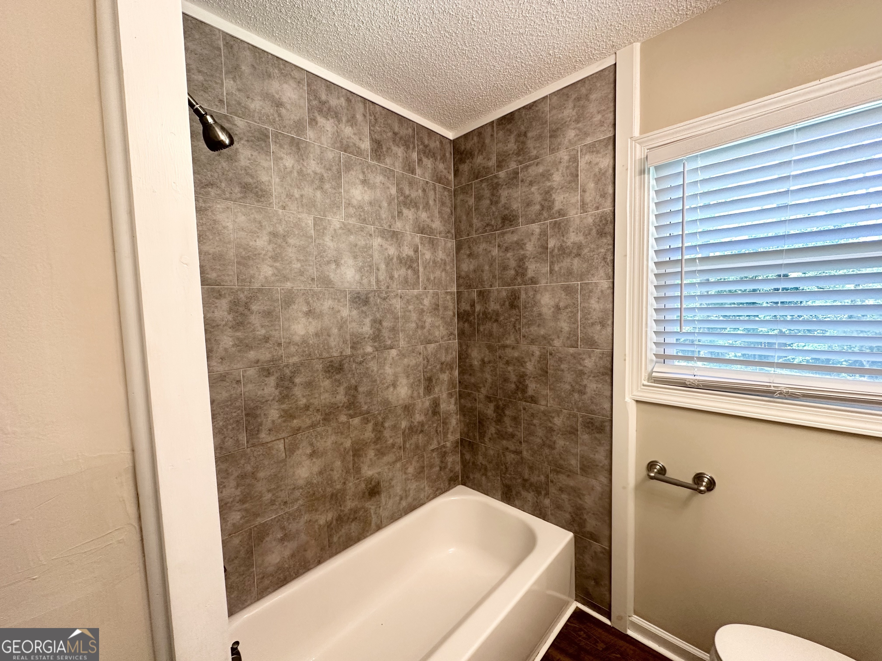 1089 Canal Street Decatur, GA 30032 - Photo 13 of 18 a bathroom with a shower and a toilet