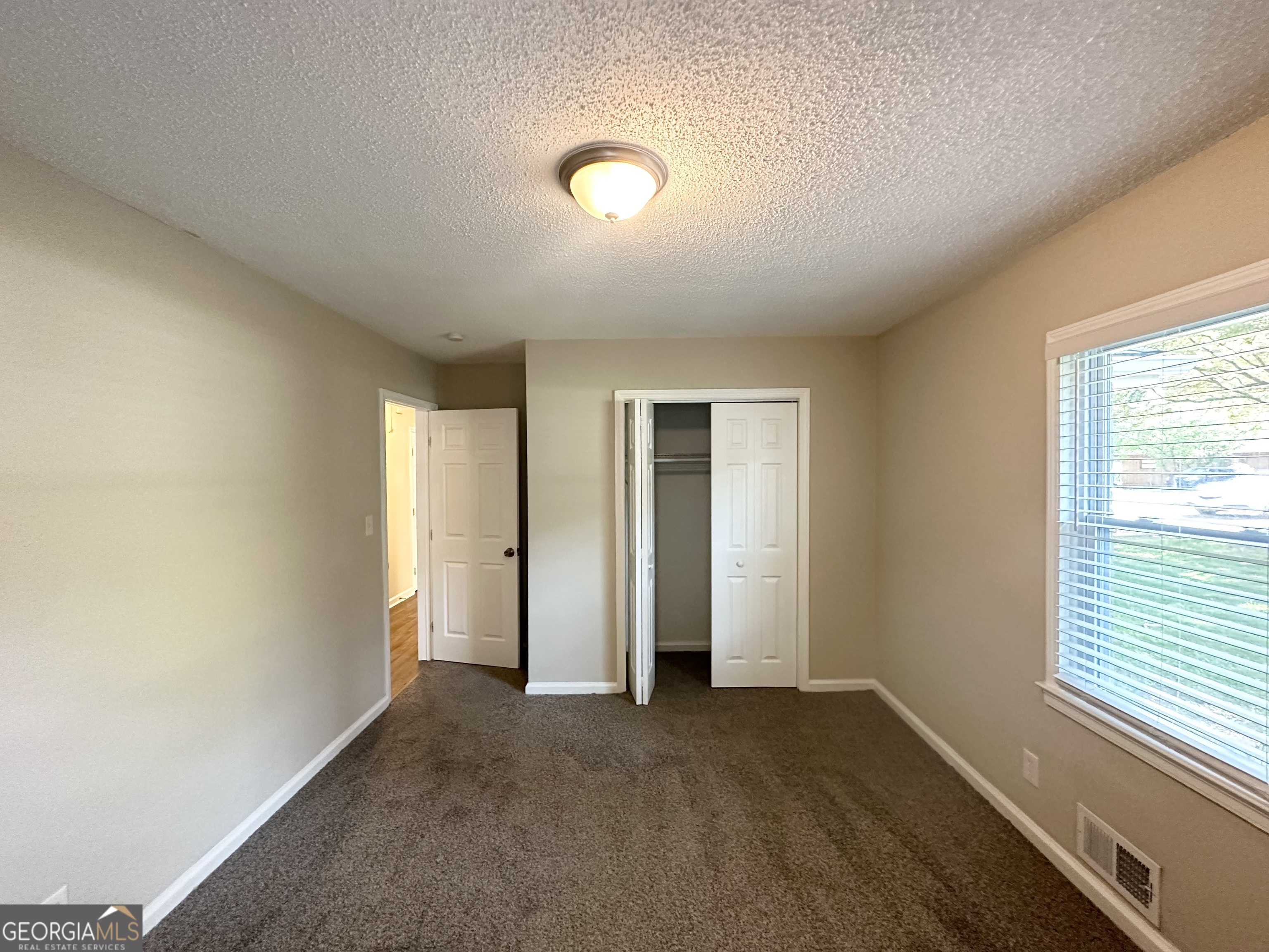1089 Canal Street Decatur, GA 30032 - Photo 15 of 18 an empty room with windows and closet
