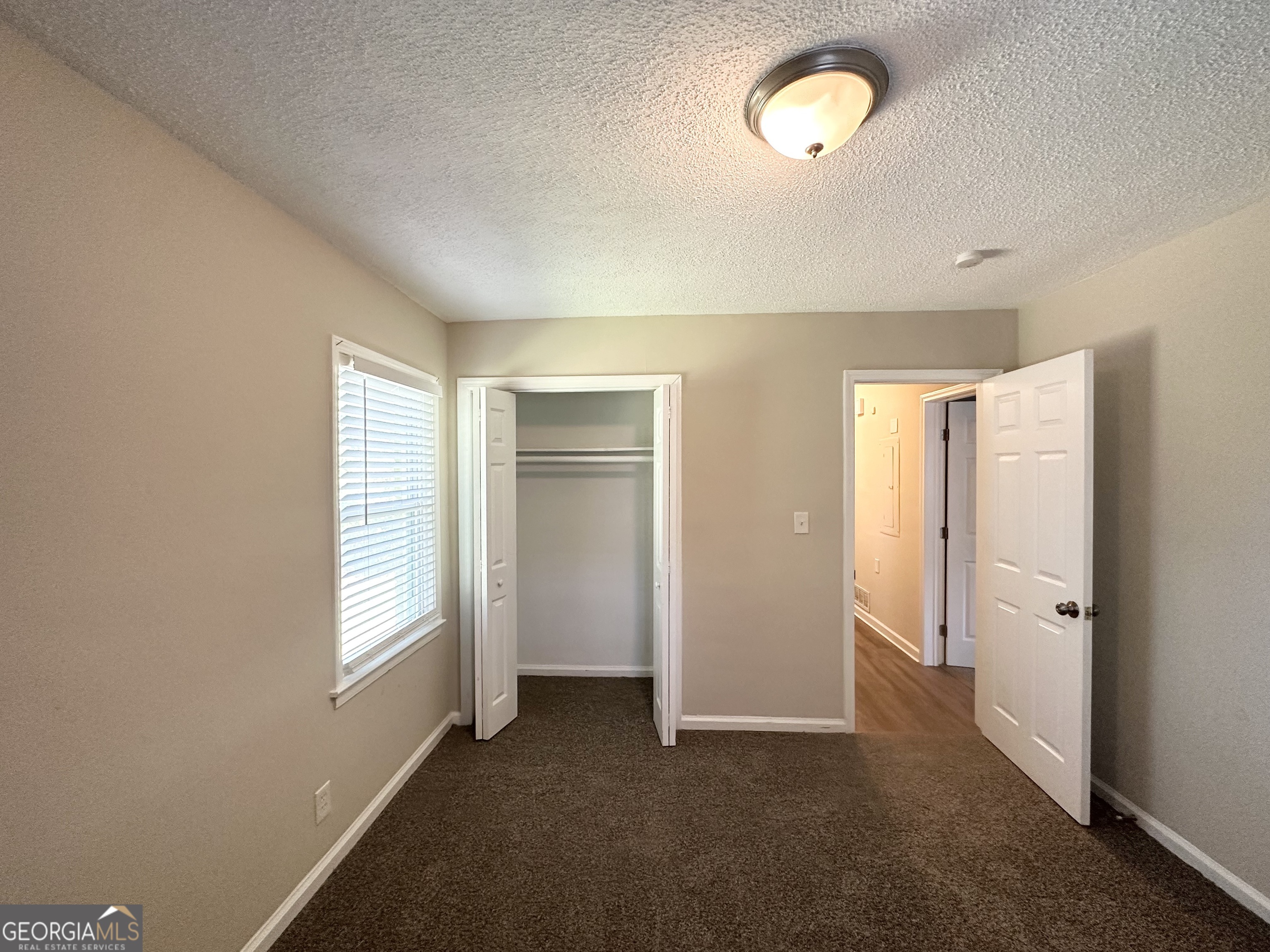 1089 Canal Street Decatur, GA 30032 - Photo 17 of 18 an empty room with windows and closet