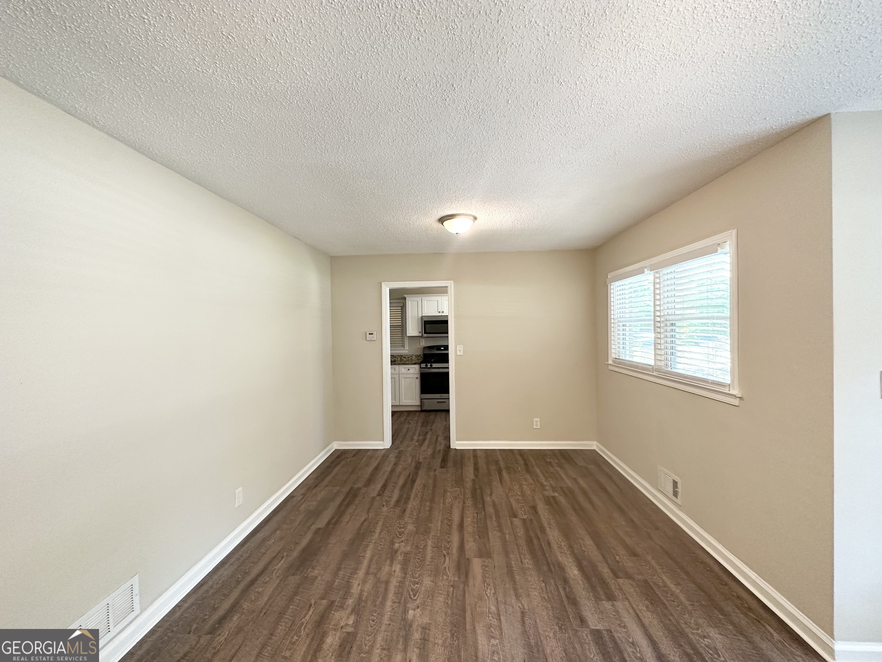 1089 Canal Street Decatur, GA 30032 - Photo 3 of 18 wooden floor in an empty room with a window