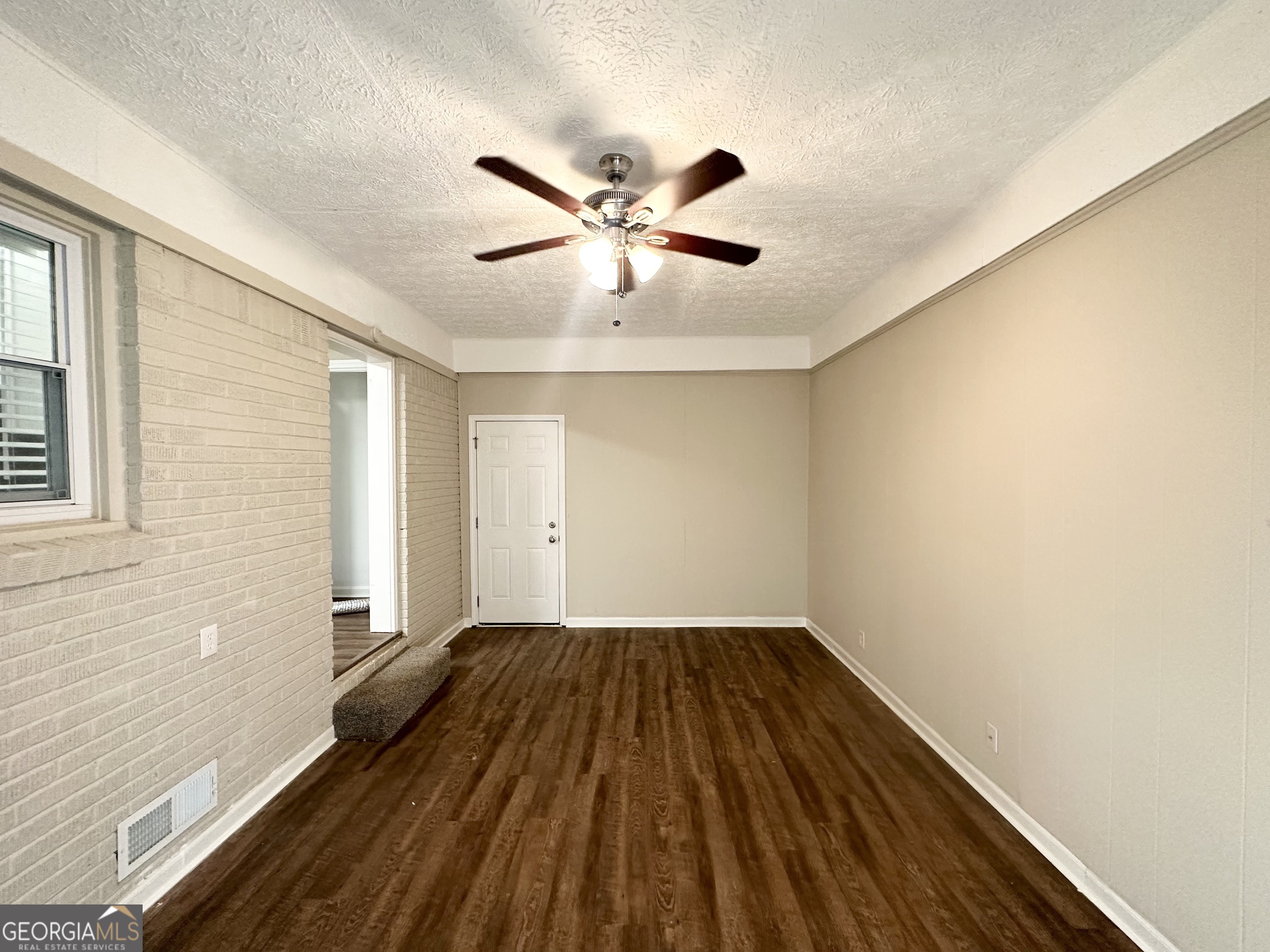 1089 Canal Street Decatur, GA 30032 - Photo 9 of 18 a view of empty room with wooden floor and fan