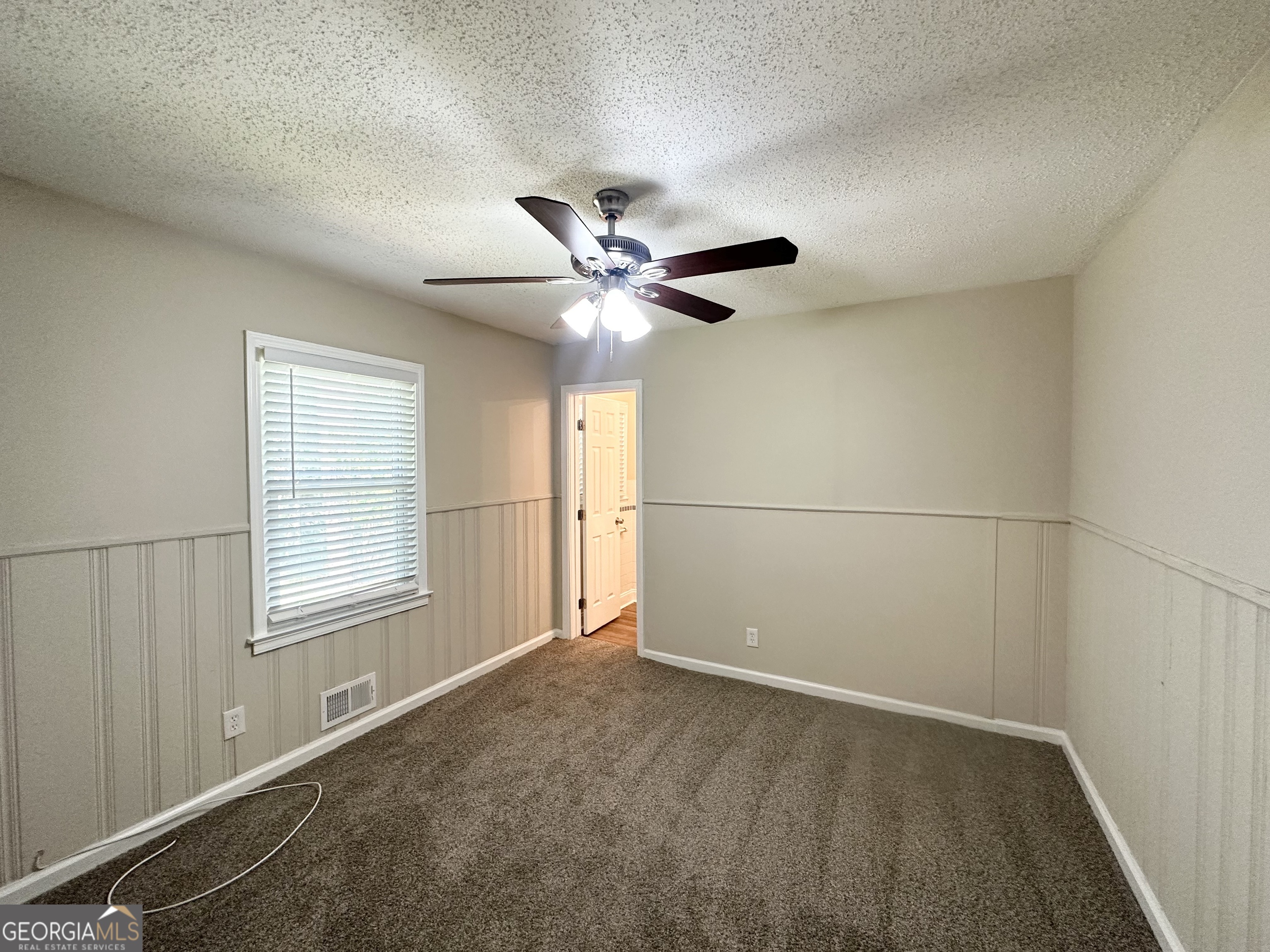 1089 Canal Street Decatur, GA 30032 - Photo 10 of 18 a view of an empty room with a ceiling fan