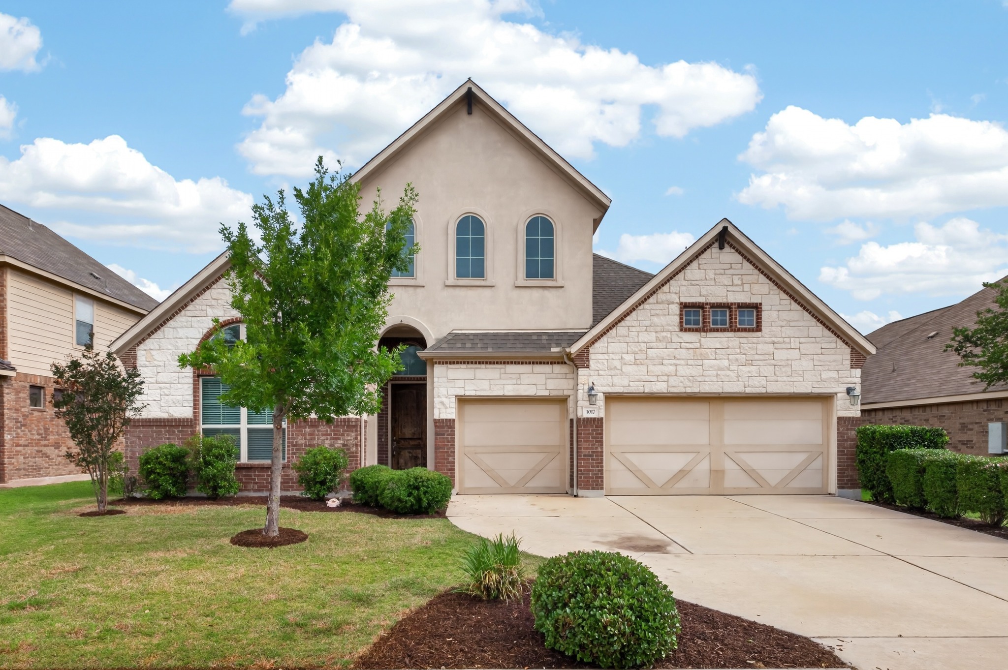 1017 Tabernash Leander, TX 78641 - Photo 1 of 38 Two-story residence featuring a combination of brick, stone, and stucco siding