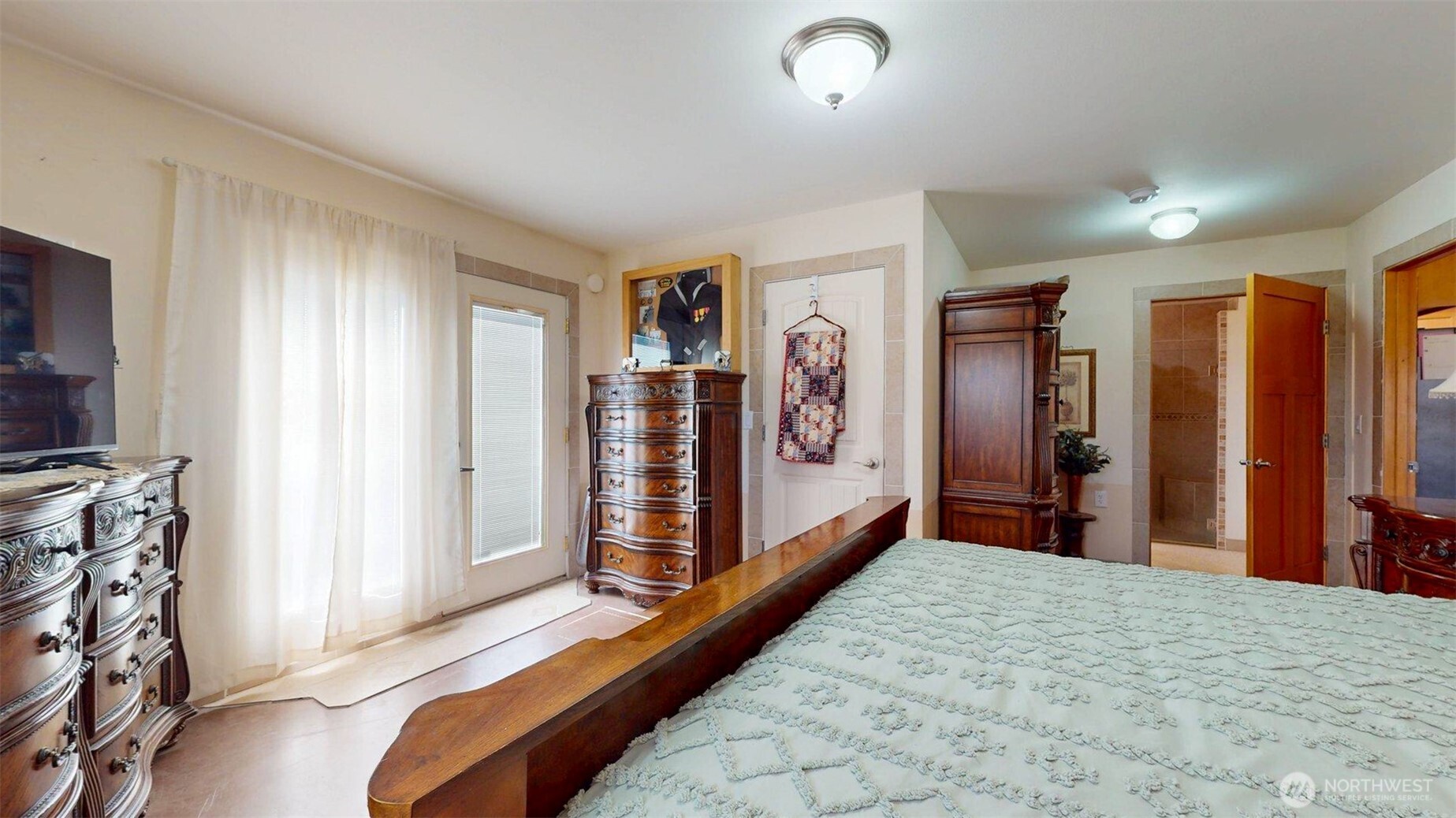 46 Shumway Road Omak, WA 98841 - Photo 16 of 40 a view of a bedroom with bed and hallway