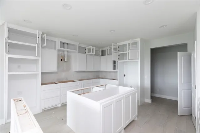 a utility room with cabinets
