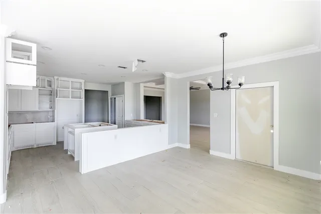 a view of a living room and kitchen with furniture