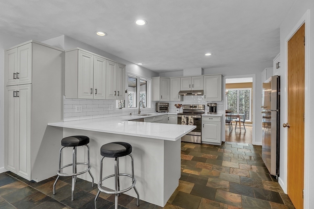 80 Elizabeth Ridge Road Carlisle, MA 01741 - Photo 13 of 33 a kitchen with counter top space cabinets and stainless steel appliances
