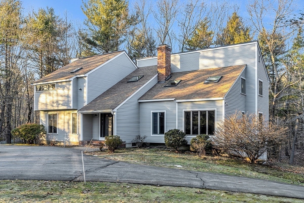 80 Elizabeth Ridge Road Carlisle, MA 01741 - Photo 2 of 33 a view of a house with a yard