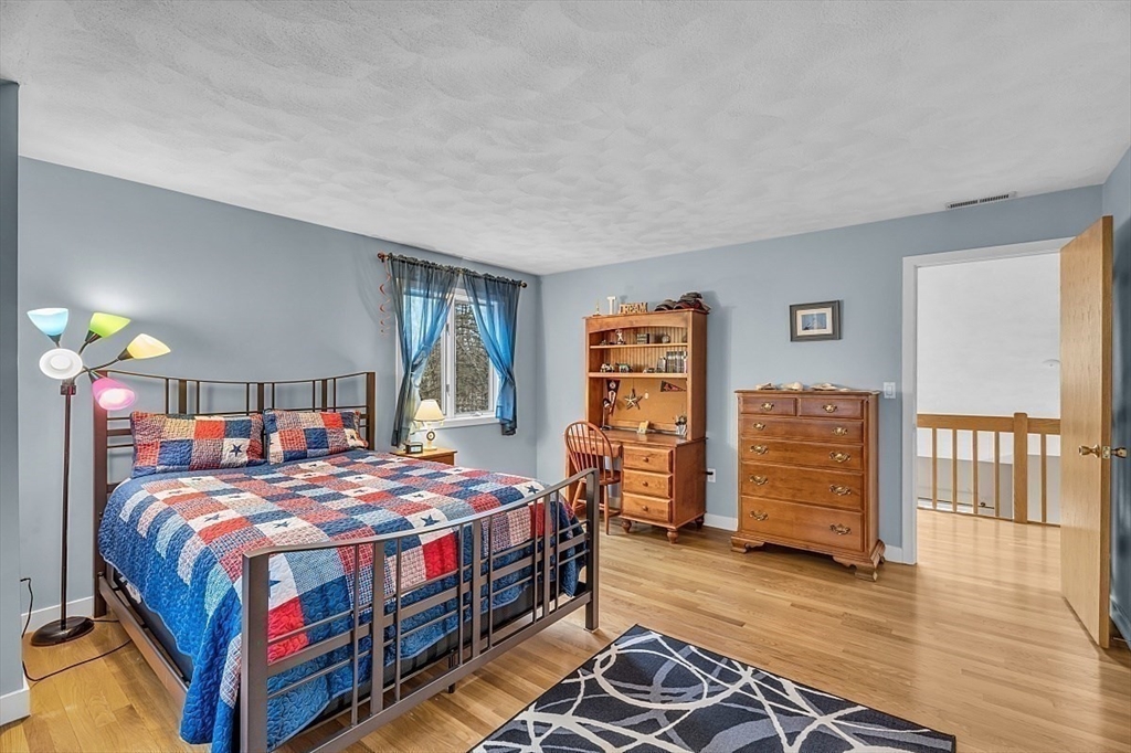 80 Elizabeth Ridge Road Carlisle, MA 01741 - Photo 26 of 33 a bedroom with a bed and a closet