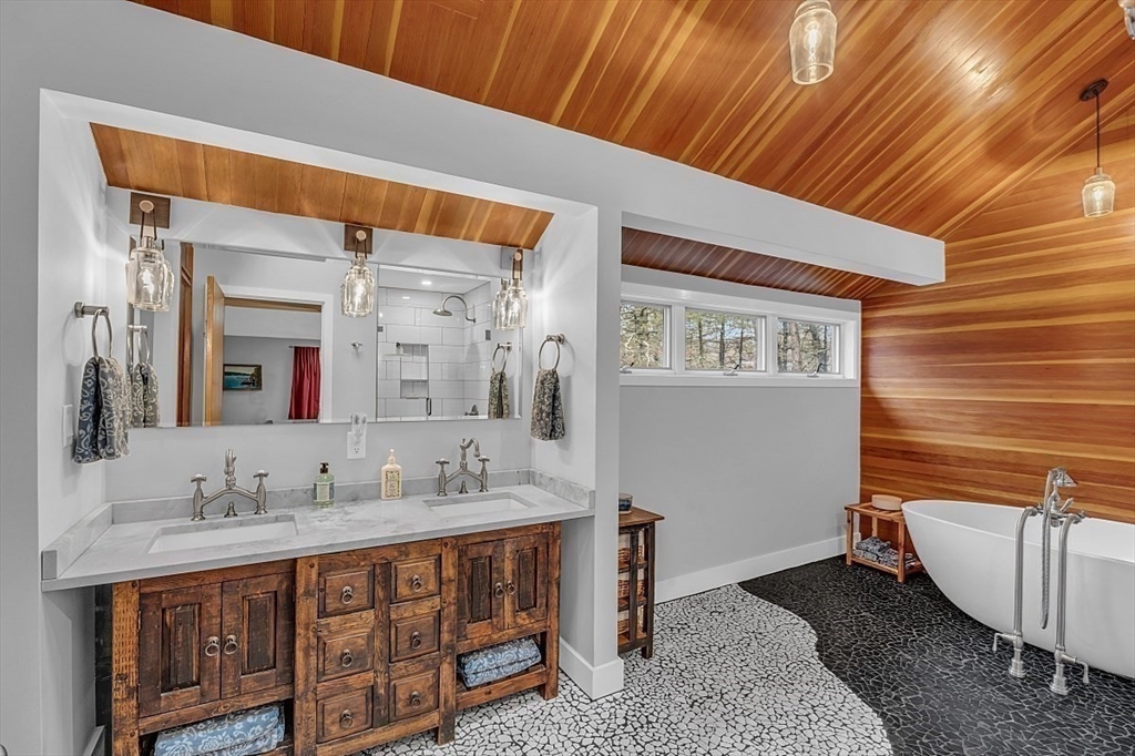 80 Elizabeth Ridge Road Carlisle, MA 01741 - Photo 30 of 33 a spacious bathroom with a double vanity sink and a mirror