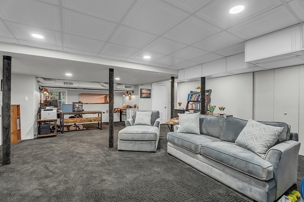 80 Elizabeth Ridge Road Carlisle, MA 01741 - Photo 31 of 33 a living room with furniture and a couch