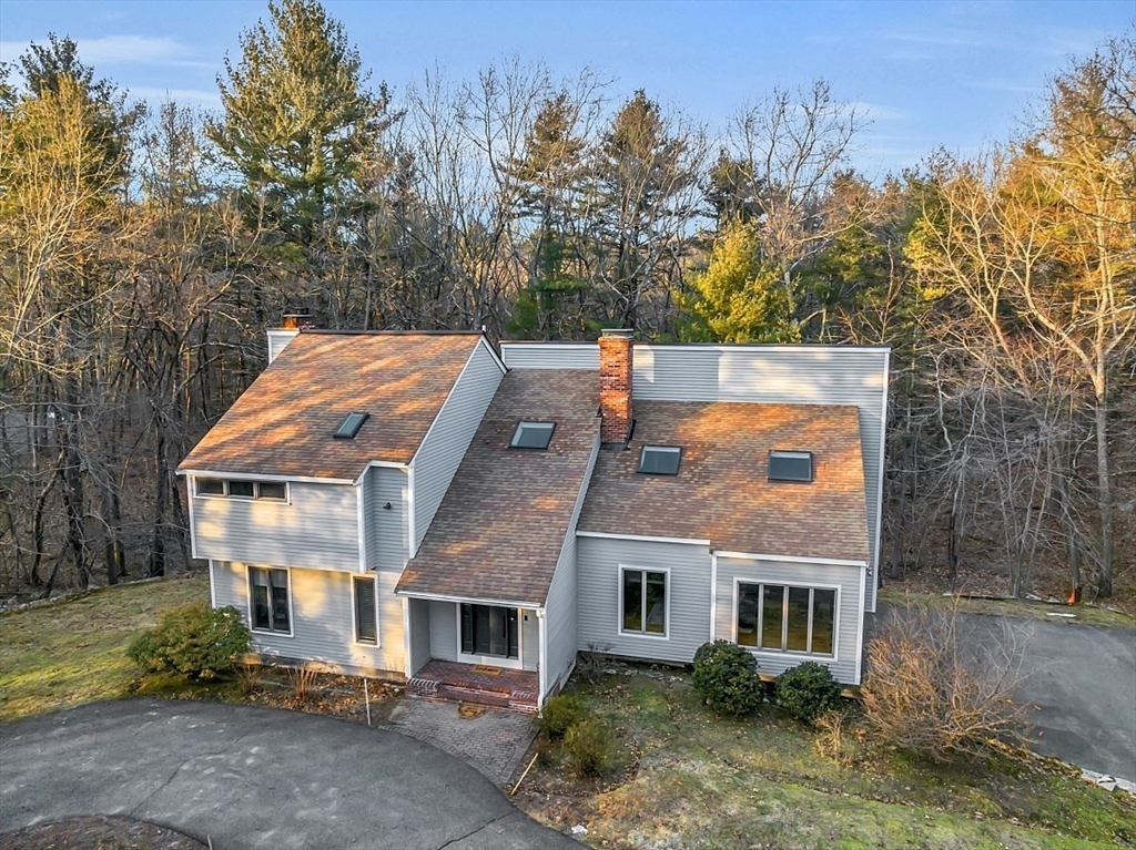 80 Elizabeth Ridge Road Carlisle, MA 01741 - Photo 4 of 33 a aerial view of a house with a yard