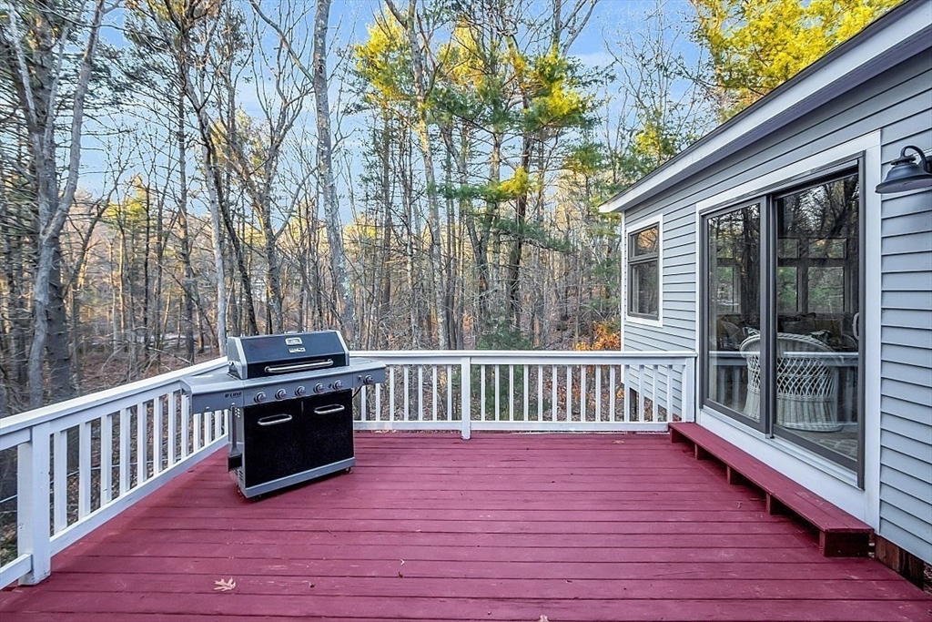 80 Elizabeth Ridge Road Carlisle, MA 01741 - Photo 6 of 33 a view of wooden floor with a bench