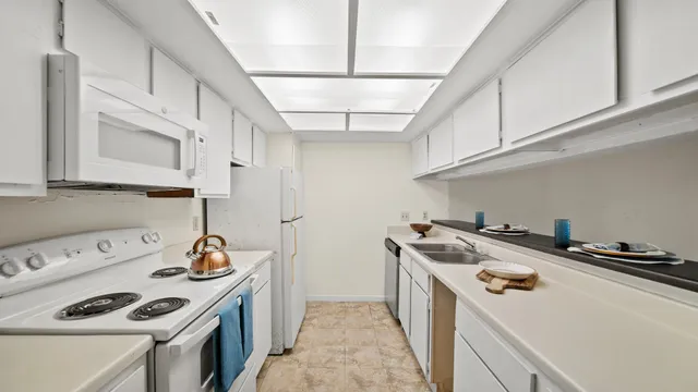 a kitchen with a stove and a sink