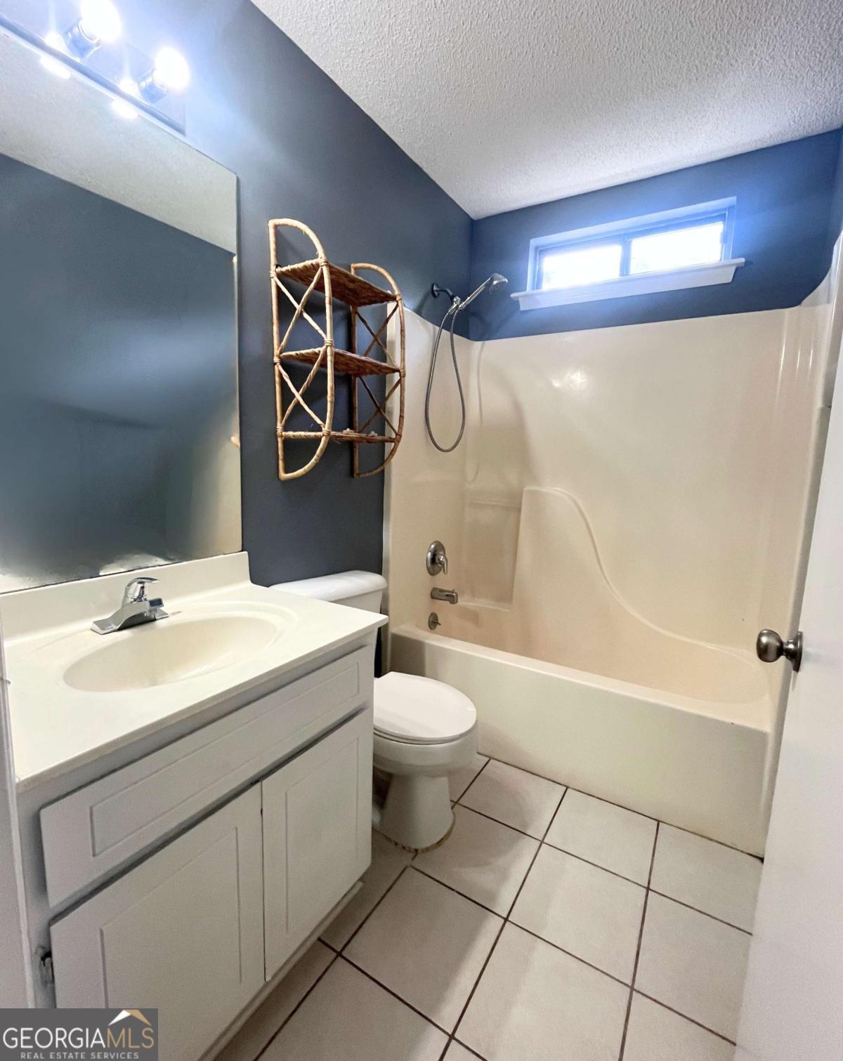 317 Lake View Drive Kingsland, GA 31548 - Photo 28 of 51 a bathroom with a sink a toilet and shower