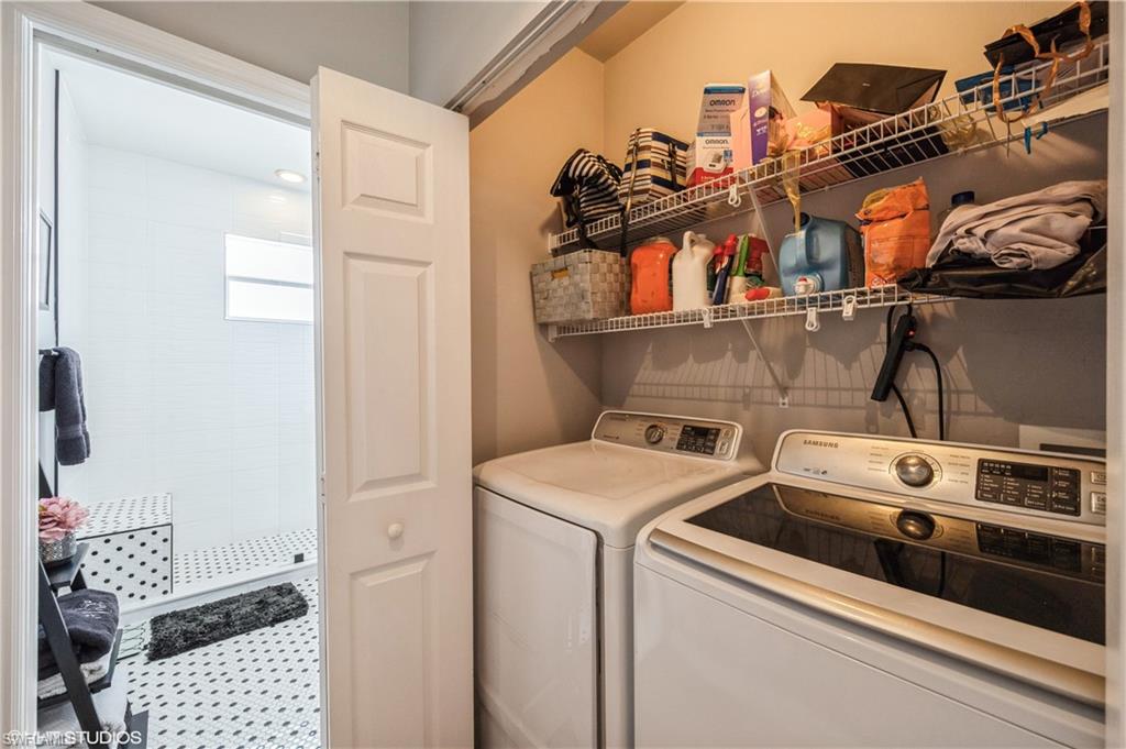 290 Robin Hood Circle, Unit 202 Naples, FL 34104 - Photo 36 of 38 a utility room with dryer and washer