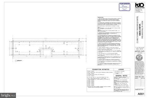 a picture of a bench in front of a building