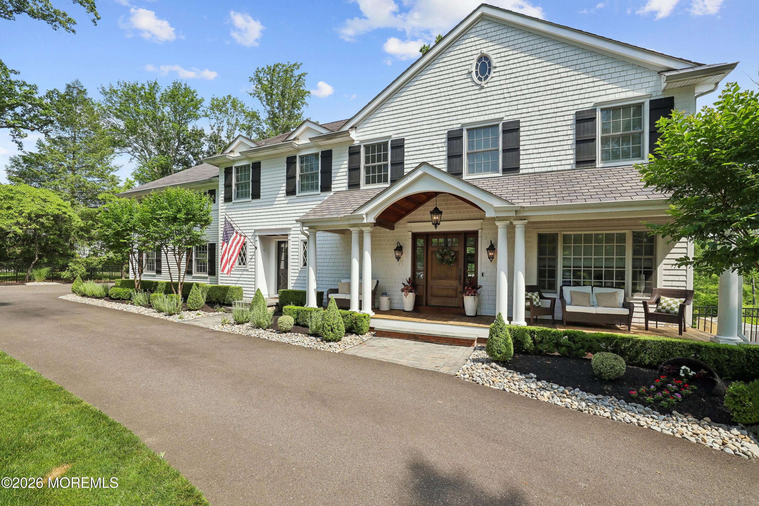 92 Tulip Lane Colts Neck, NJ 07722 - Photo 5 of 55 a front view of a house with a yard