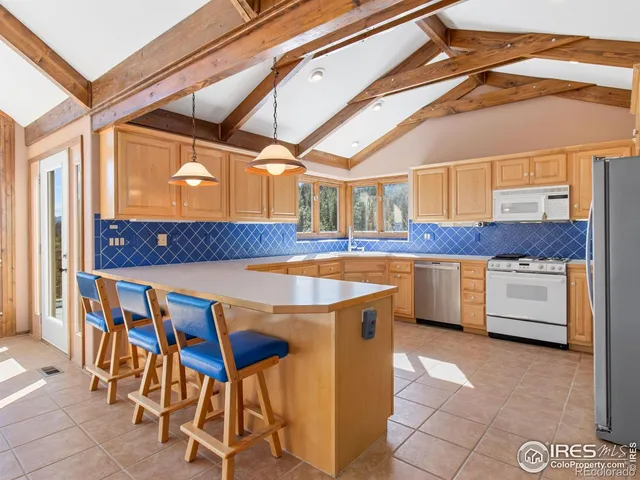 a kitchen with granite countertop a sink and a cabinets