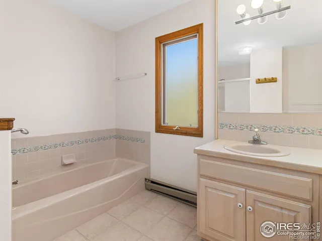 a bathroom with a bathtub and a sink