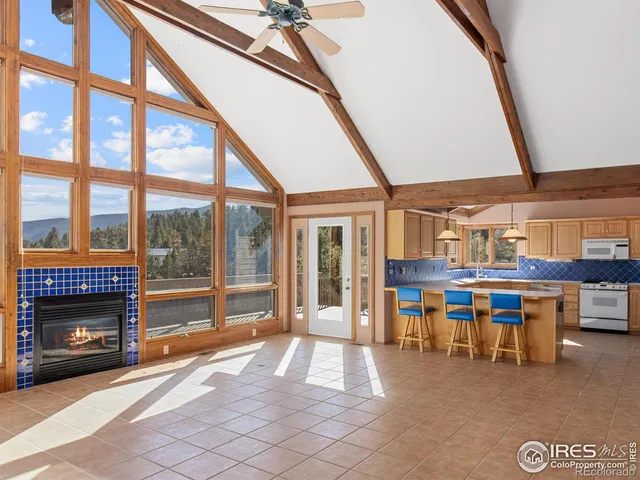a dining room with furniture and a fireplace