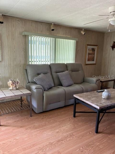 3141 Nantucket Drive Holiday, FL 34690 - Photo 12 of 29 a living room with furniture and a potted plant