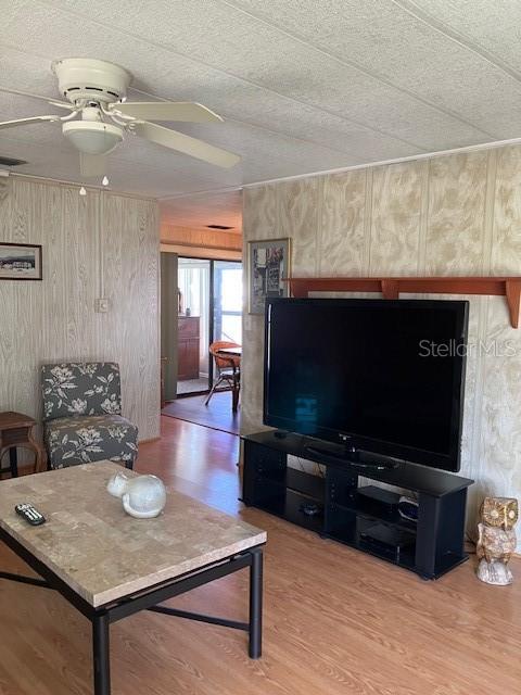3141 Nantucket Drive Holiday, FL 34690 - Photo 13 of 29 a living room with furniture and a flat screen tv