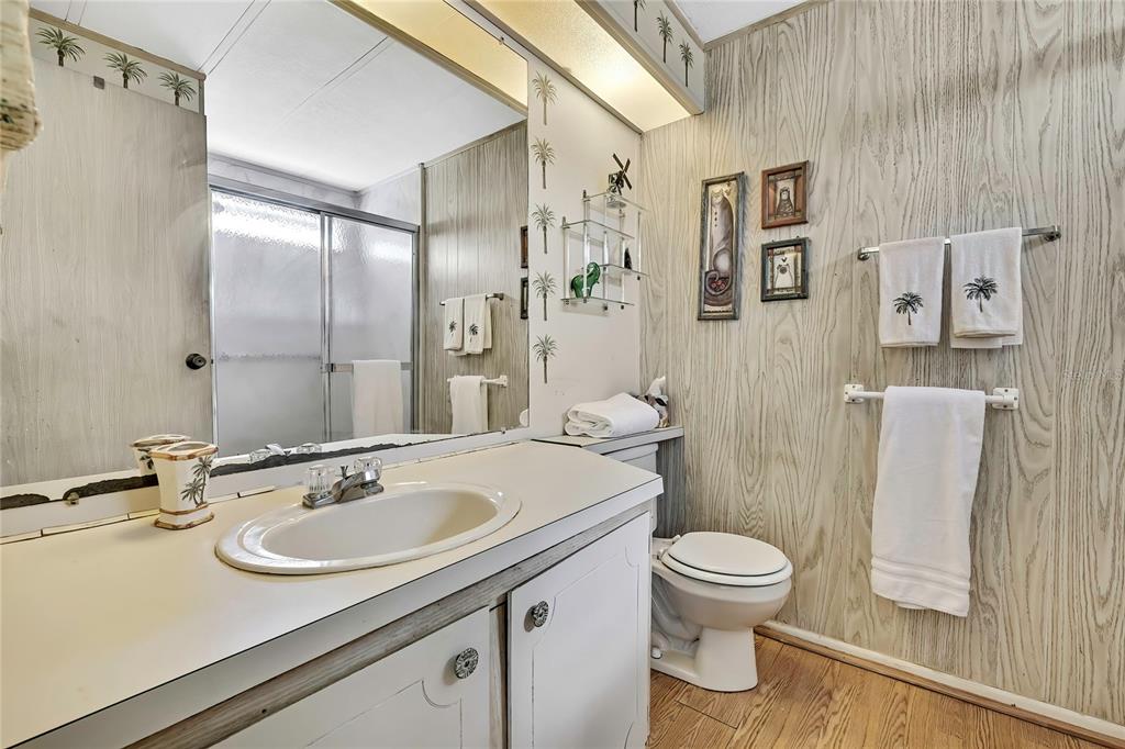 3141 Nantucket Drive Holiday, FL 34690 - Photo 14 of 34 a bathroom with a sink toilet and a mirror