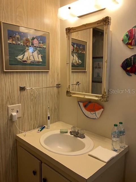 3141 Nantucket Drive Holiday, FL 34690 - Photo 16 of 29 a bathroom with a sink and a mirror with toilet