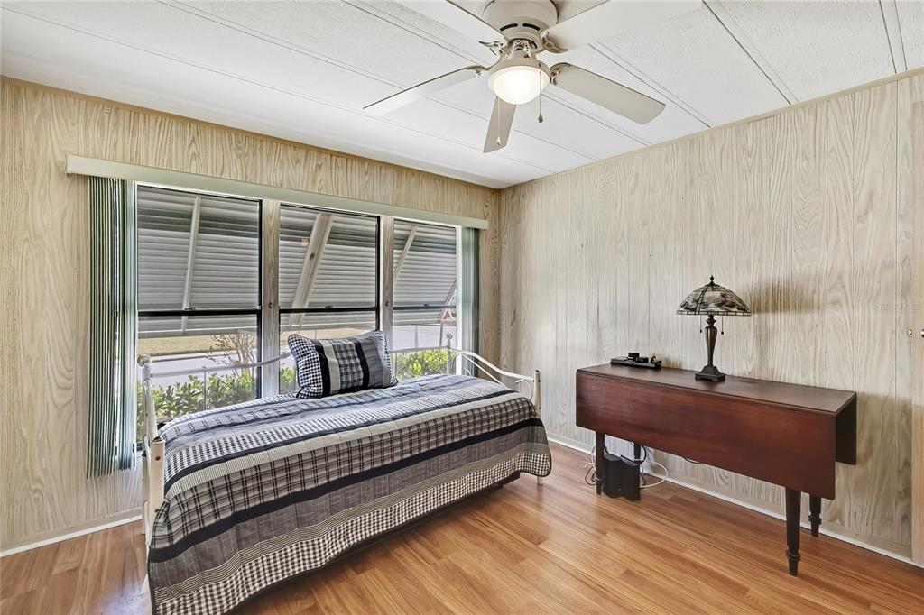 3141 Nantucket Drive Holiday, FL 34690 - Photo 17 of 34 a bedroom with a bed and a table