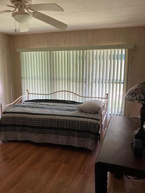 3141 Nantucket Drive Holiday, FL 34690 - Photo 18 of 29 a bedroom with a bed and a large window