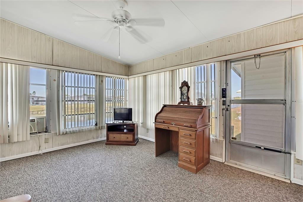 3141 Nantucket Drive Holiday, FL 34690 - Photo 19 of 34 a living room with a balcony furniture and a window